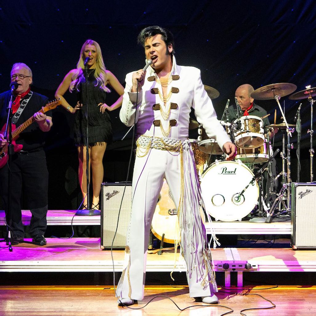 Mark Summers, performing as Elvis Presley with his band